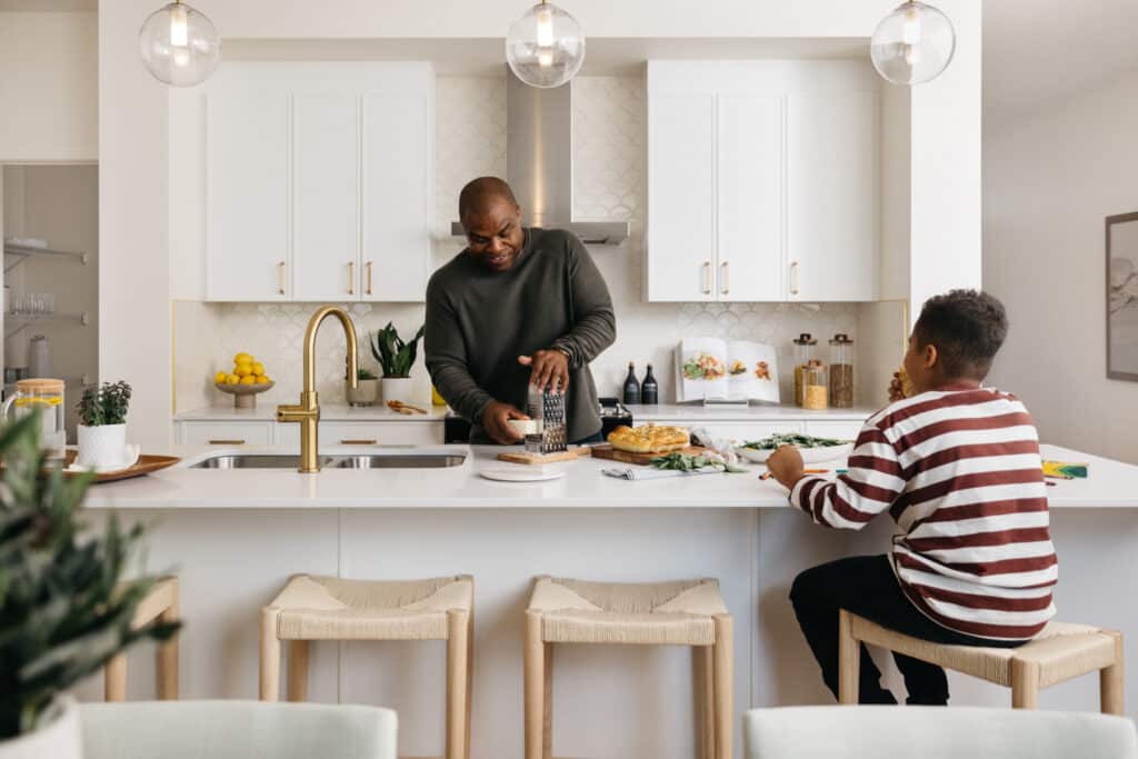 Family cooking together in a Cantiro Homes