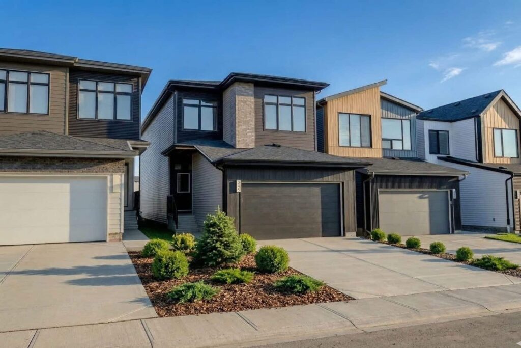 Streetscape of Cantiro Homes in the Roseburn community in Fort Saskatchewan, Alberta, featuring new townhomes and front‑drive single family homes.
