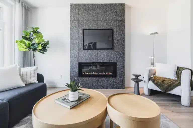 Contemporary living room with fireplace in Rosenthal homes for sale featuring stylish finishes by Cantiro Homes Rosenthal