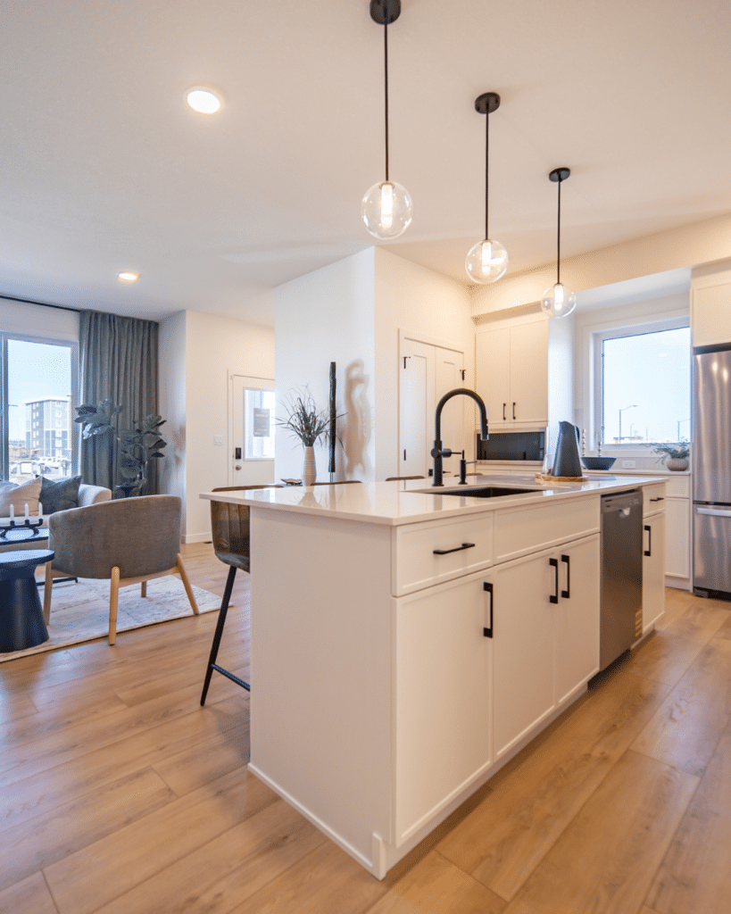 Open-concept kitchen and living area in Edmonton townhouse perfect for lock-and-leave downsizing lifestyle