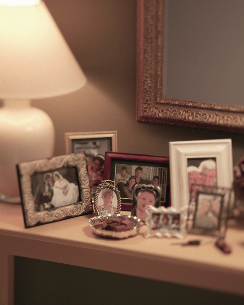 Personal family photos representing emotional aspects of downsizing for seniors transitioning homes