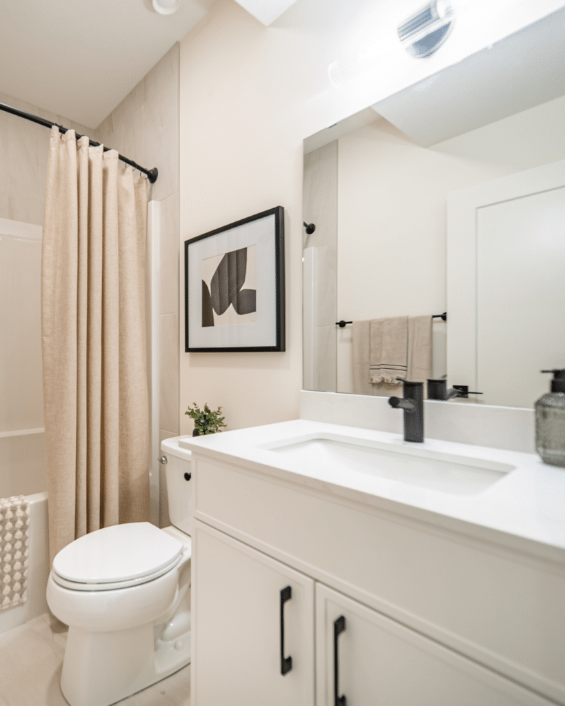 Bright bathroom with simple layout and easy-access features suited for seniors downsizing into Edmonton homes