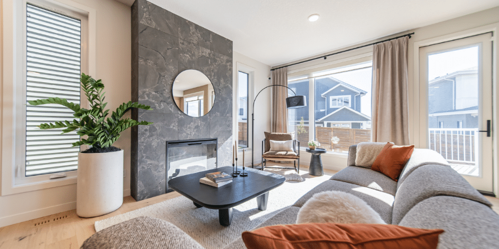 Bright and modern living room in a newly built home, reflecting interior design and quality craftsmanship from Edmonton home builders.